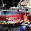 A red and white fire truck driving in a parade..jpg